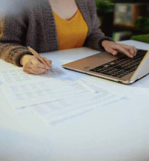 business woman with documents and laptop working.